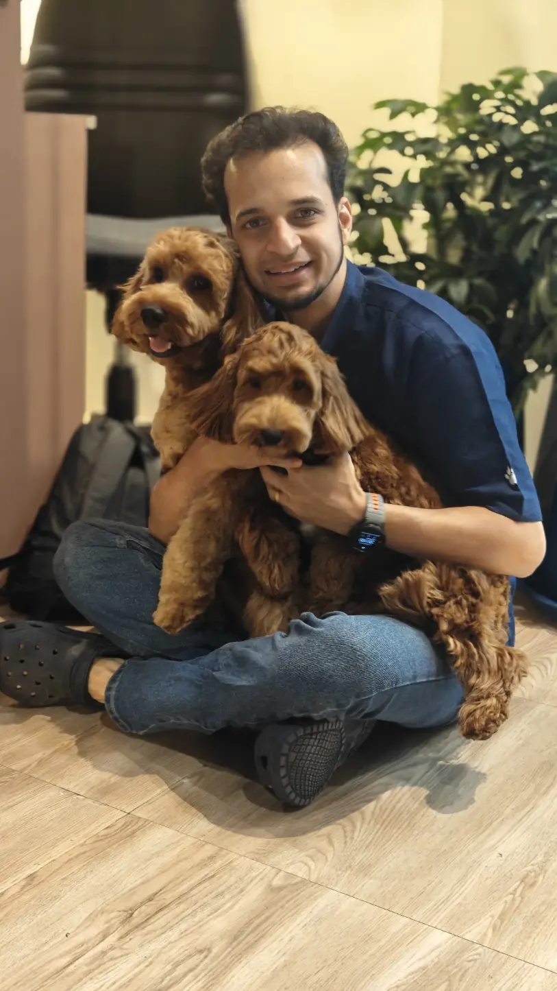 Mihir with dogs at Beauty in the Beast